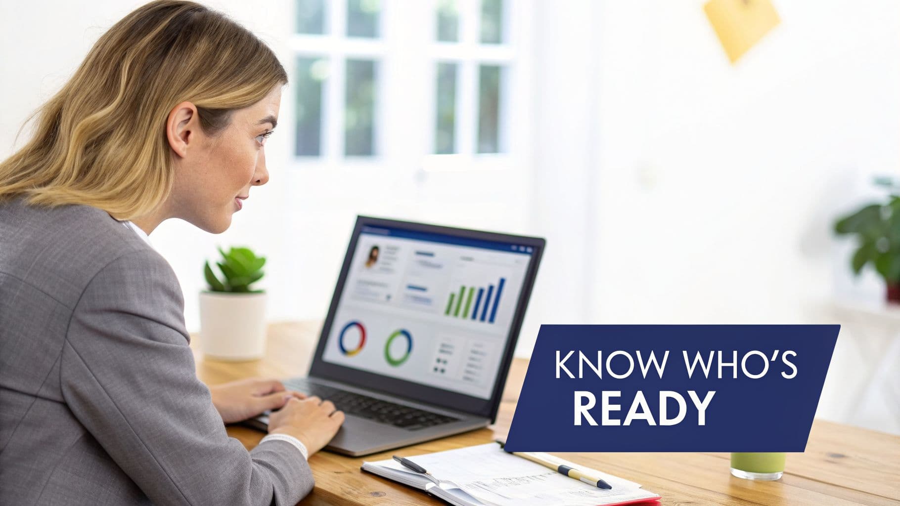 A professional woman working on a laptop showing business analytics, with a "KNOW WHO'S READY" message.